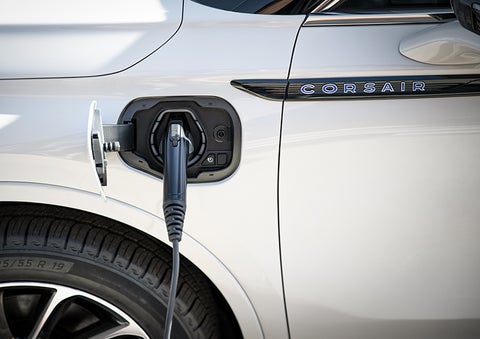 A 2023 Lincoln Corsair® Grand Touring model is shown being charged via the driver’s side charging port. | Rydell Lincoln in Independence IA