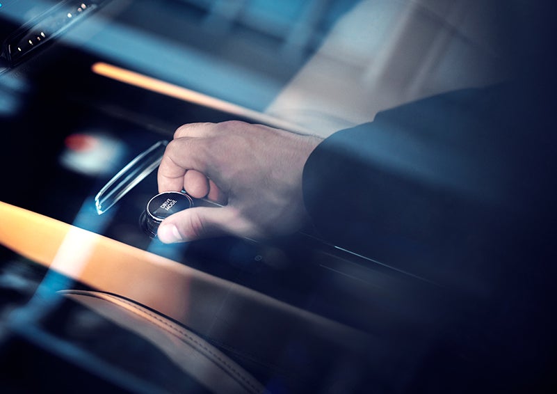 The driver of a 2023 Lincoln Corsair® SUV is shown adjusting the drive mode. | Rydell Lincoln in Independence IA
