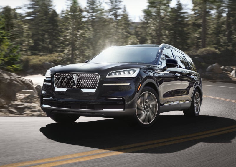 A Lincoln Aviator® SUV is being driven on a winding mountain road | Rydell Lincoln in Independence IA