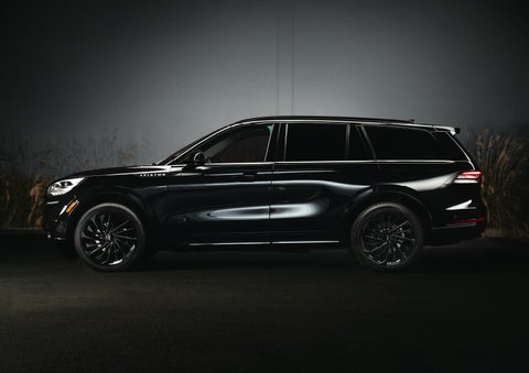 A 2024 Lincoln Aviator® SUV is shown in the Infinite Black exterior color | Rydell Lincoln in Independence IA