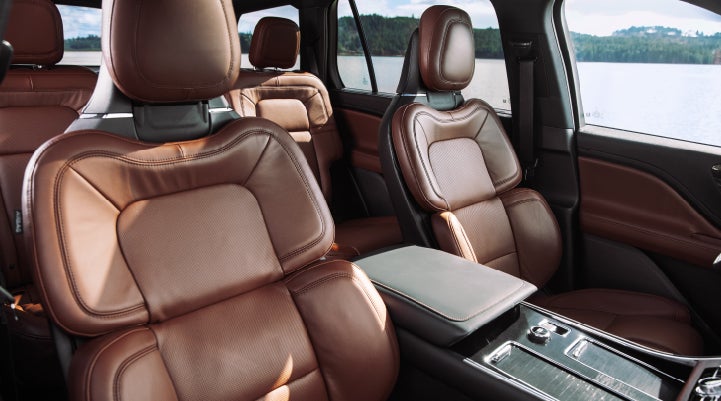 The front row's Perfect Position Seats in a 2024 Lincoln Aviator® Reserve model with Ebony Roast interior | Rydell Lincoln in Independence IA