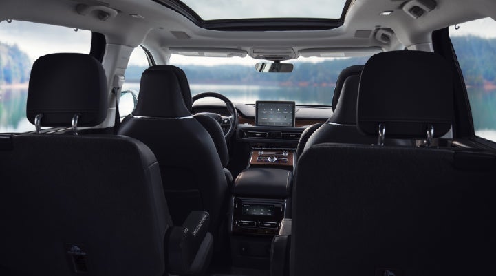 The interior of a 2024 Lincoln Aviator® SUV from behind the second row | Rydell Lincoln in Independence IA