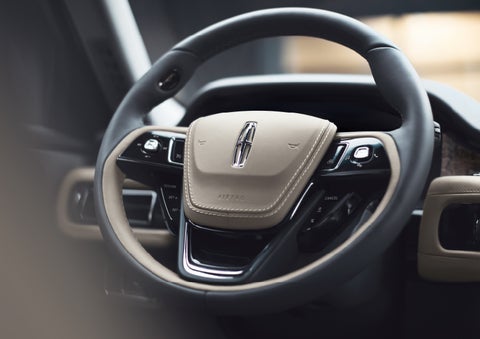 The intuitively placed controls of the steering wheel on a 2024 Lincoln Aviator® SUV | Rydell Lincoln in Independence IA
