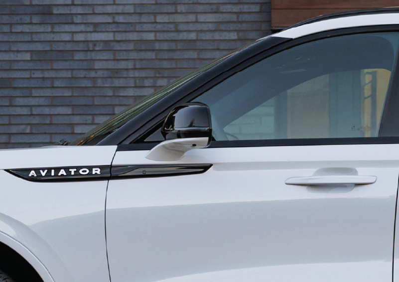The driver’s door of a white 2025 Lincoln Aviator® SUV is showcased. | Rydell Lincoln in Independence IA