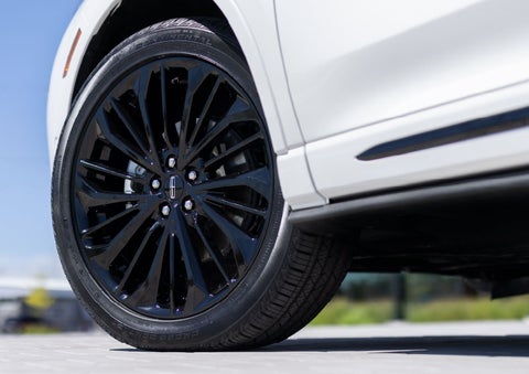 A stylish 20-inch black aluminum wheel of the available Jet Appearance Package is shown. | Rydell Lincoln in Independence IA