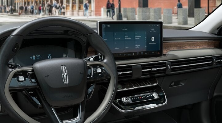 The center screen of the new 2025 Lincoln Corsair® SUV is showcased with its SYNC® 4 capabilities highlighted | Rydell Lincoln in Independence IA
