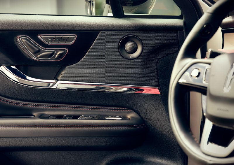 An audio speaker is shown in the driver's side door of a 2024 Lincoln Corsair® SUV. | Rydell Lincoln in Independence IA