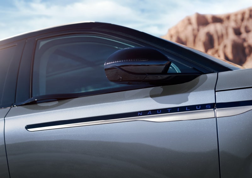 Blue lettering on the side of the vehicle that reads nautilus indicates the available hybrid powertrain. | Rydell Lincoln in Independence IA