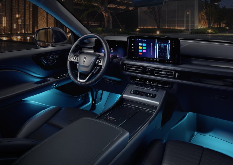 Deep blue ambient lighting glows from various places within a 2026 Lincoln Aviator® SUV. | Rydell Lincoln in Independence IA