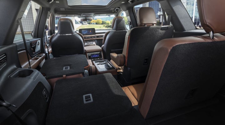 One side of the PowerFold® third-row seat and a second-row seat are folded forward in the 2026 Lincoln Aviator® SUV. | Rydell Lincoln in Independence IA