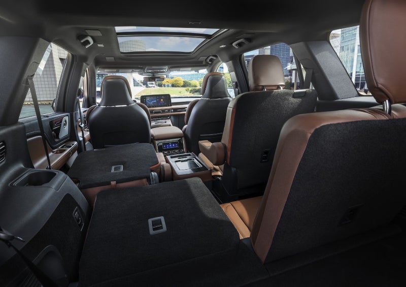 One side of the PowerFold® third-row seat and a second-row seat are folded forward in the 2026 Lincoln Aviator® SUV. | Rydell Lincoln in Independence IA