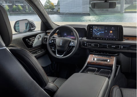The interior of the 2026 Lincoln Aviator® SUV is shown parked with a view of a harbor through the windshield. | Rydell Lincoln in Independence IA