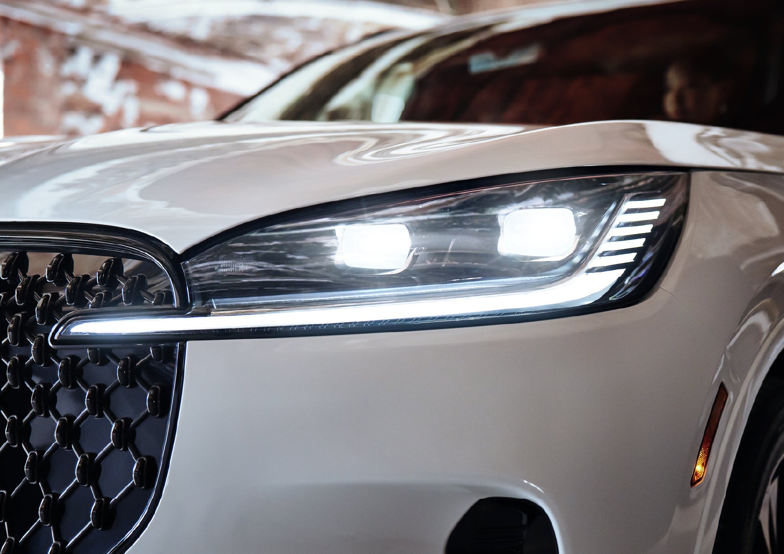 A close-up of a headlamp on the 2027 Lincoln Aviator® SUV is shown. | Rydell Lincoln in Independence IA