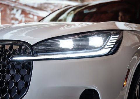 A close-up of a headlamp on the 2027 Lincoln Aviator® SUV is shown. | Rydell Lincoln in Independence IA