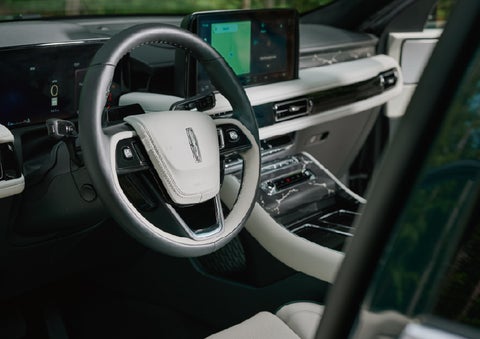 The leather-trimmed steering wheel of a 2027 Lincoln Aviator® Black Label™ SUV. | Rydell Lincoln in Independence IA